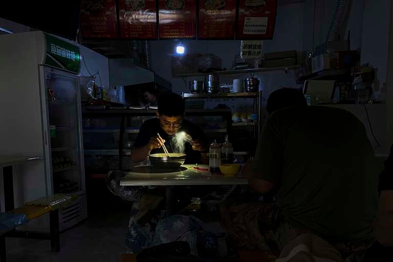 Chinese Make Use Of Generators, Torchlights As Blackout Hits China
